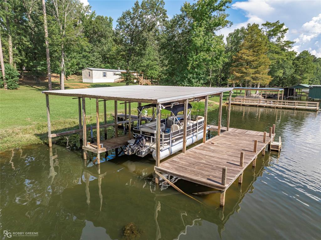 223 Razorback Lane Homer, LA 71040 - Photo 32 of 37 swimming pool view with a couple of chairs