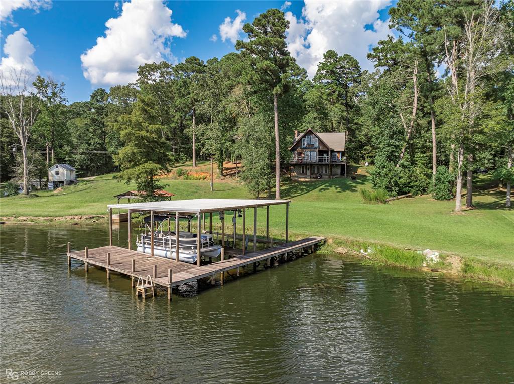 223 Razorback Lane Homer, LA 71040 - Photo 33 of 37 a view of a lake with a house