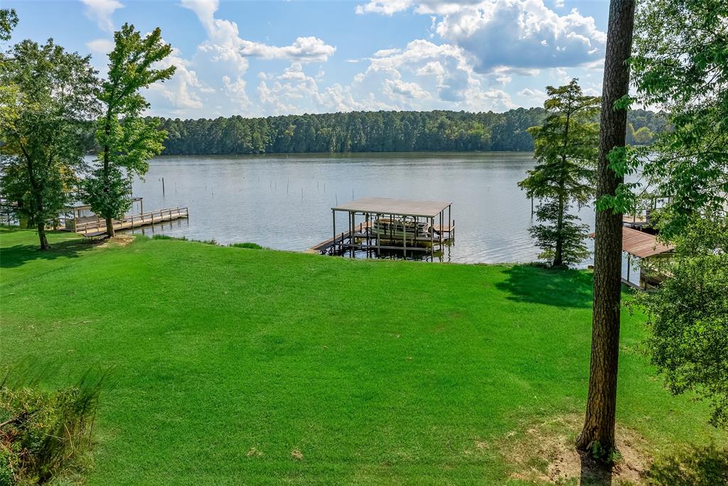 223 Razorback Lane Homer, LA 71040 - Photo 4 of 37 a view of a lake with a big yard