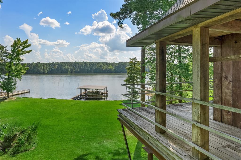 223 Razorback Lane Homer, LA 71040 - Photo 6 of 37 a view of a chairs and table on the deck