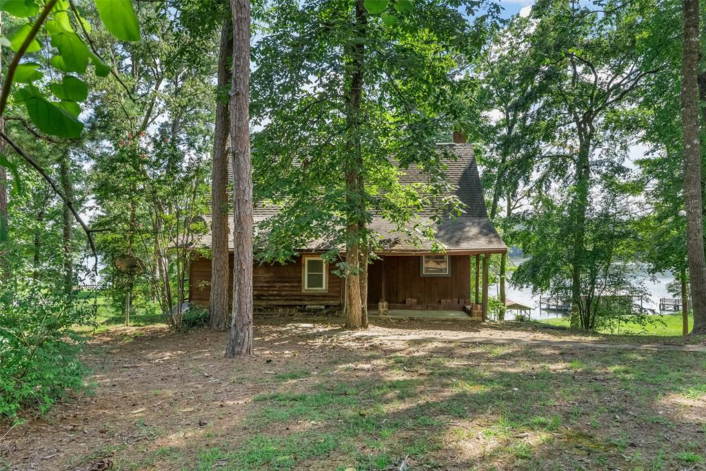 223 Razorback Lane Homer, LA 71040 - Photo 7 of 37 a front view of a house with a tree in front
