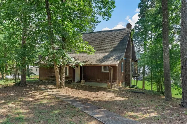 front view of a house with a tree