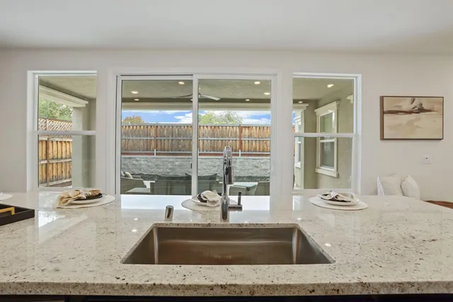 a view of bathroom with tub and window
