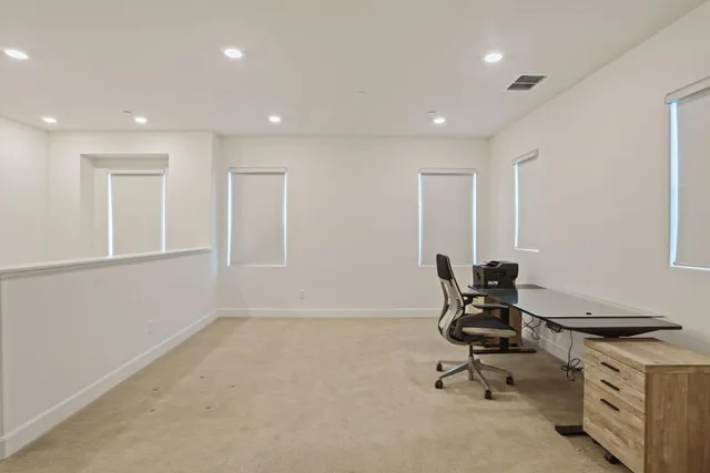 a view of a workspace with furniture