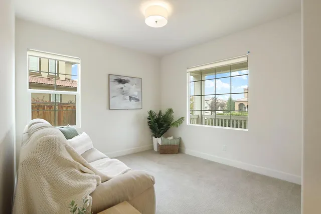 a bed room with furniture and a window