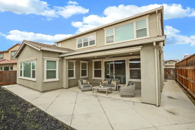 a house view with a sitting space and glass windows