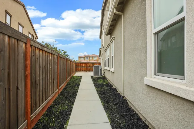 a view of a pathway of a house with wooden floor