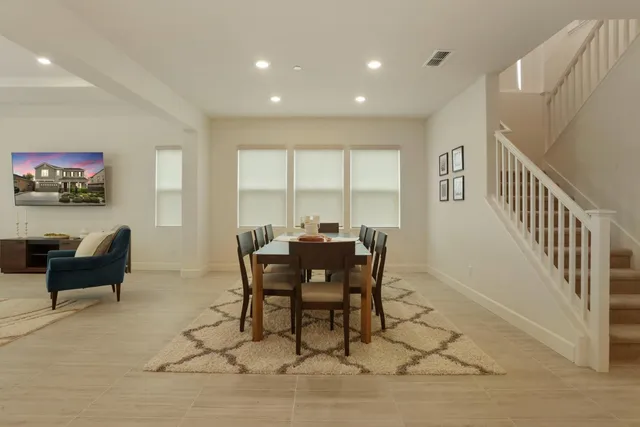a view of a dining room with furniture window and outside view
