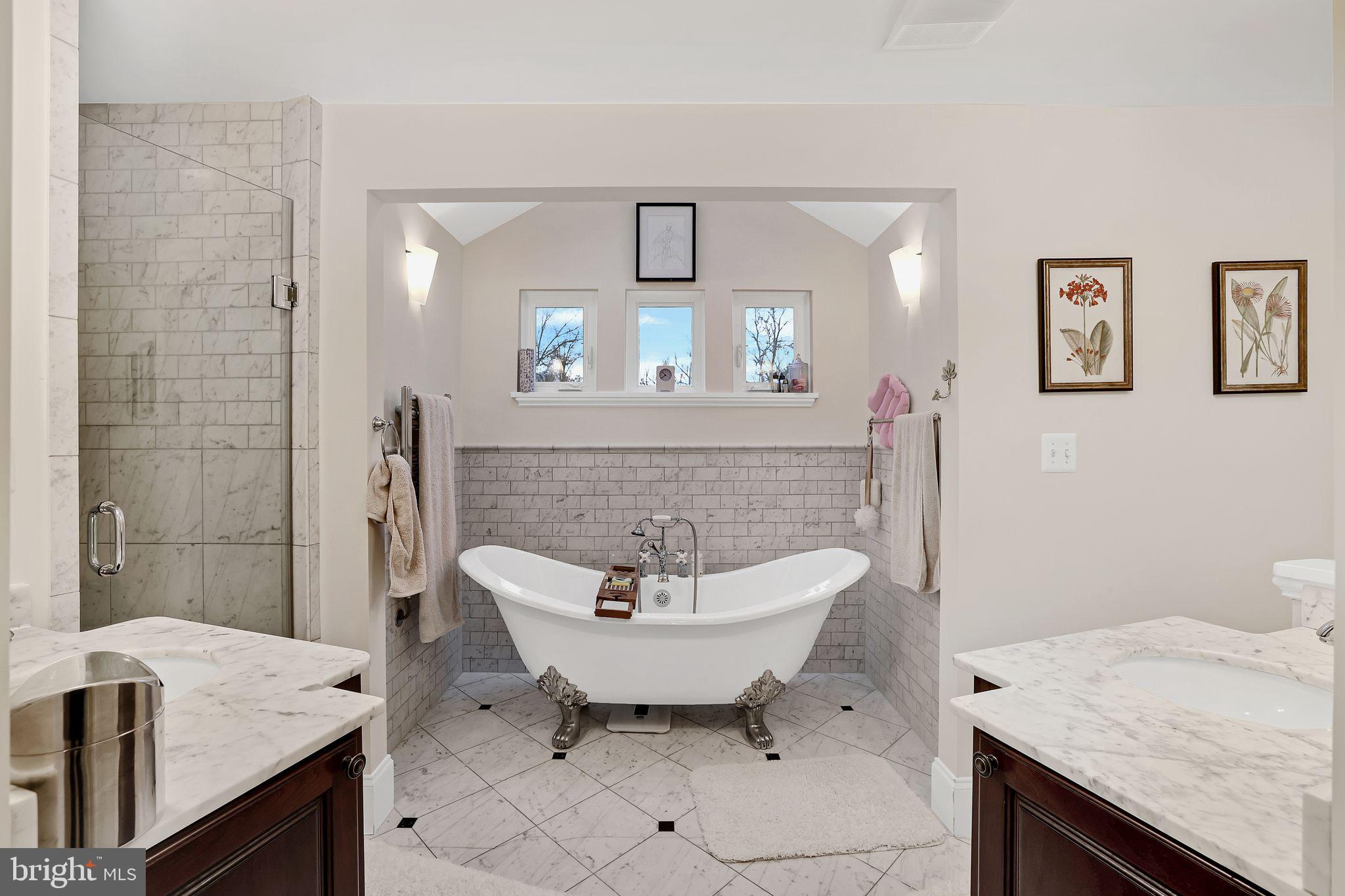 8510 Woodhaven Boulevard Bethesda, MD 20817 - Photo 12 of 18 a bathroom with a sink and a mirror