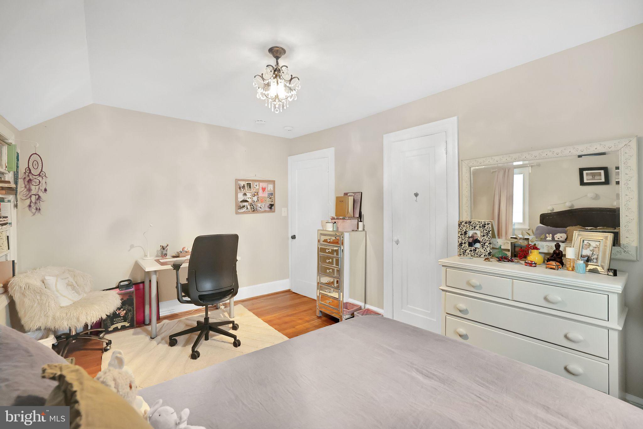 8510 Woodhaven Boulevard Bethesda, MD 20817 - Photo 14 of 18 a bedroom with a workspace