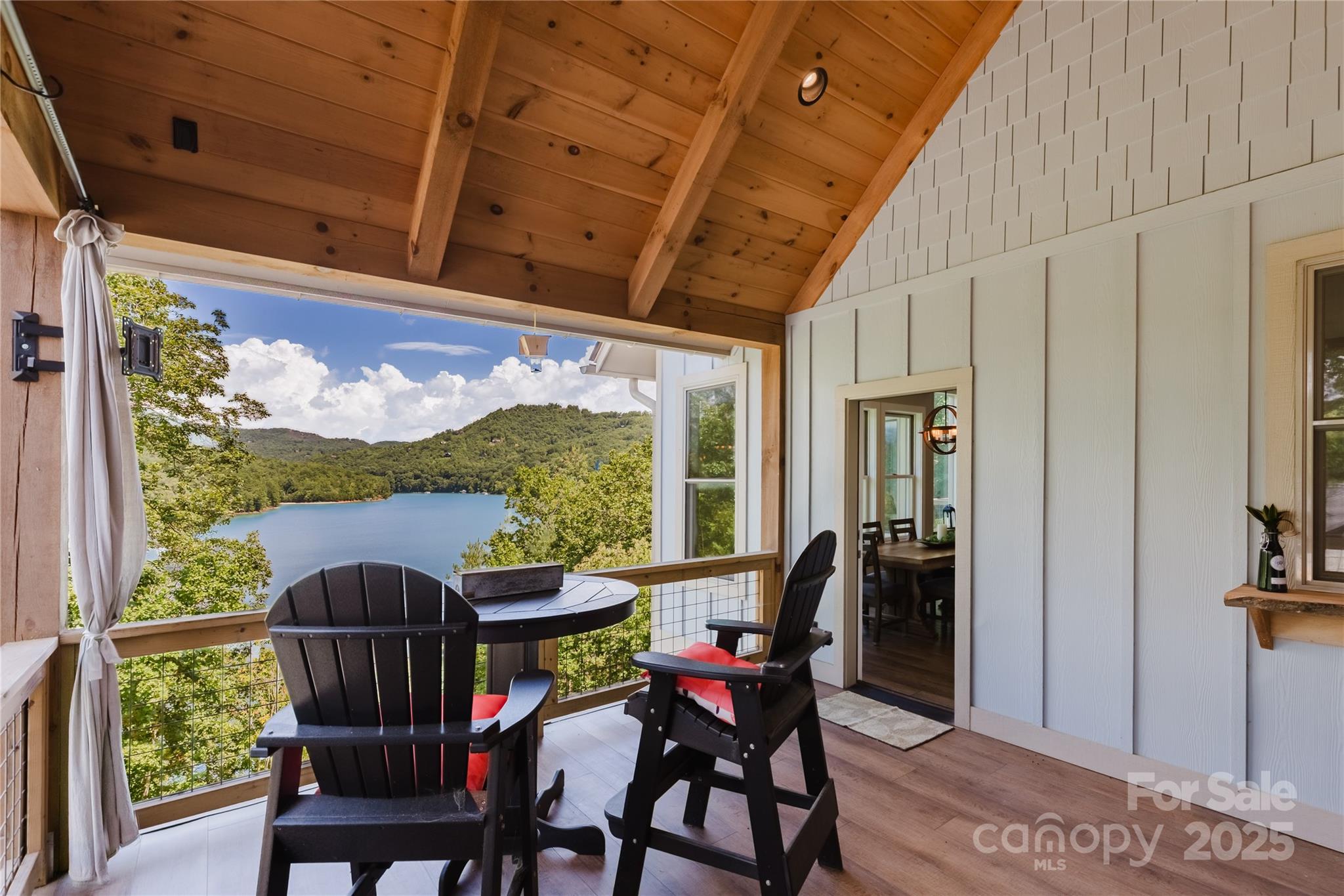 216 Alarka Point Bryson City, NC 28713 - Photo 13 of 47 a view of a porch with furniture and a window