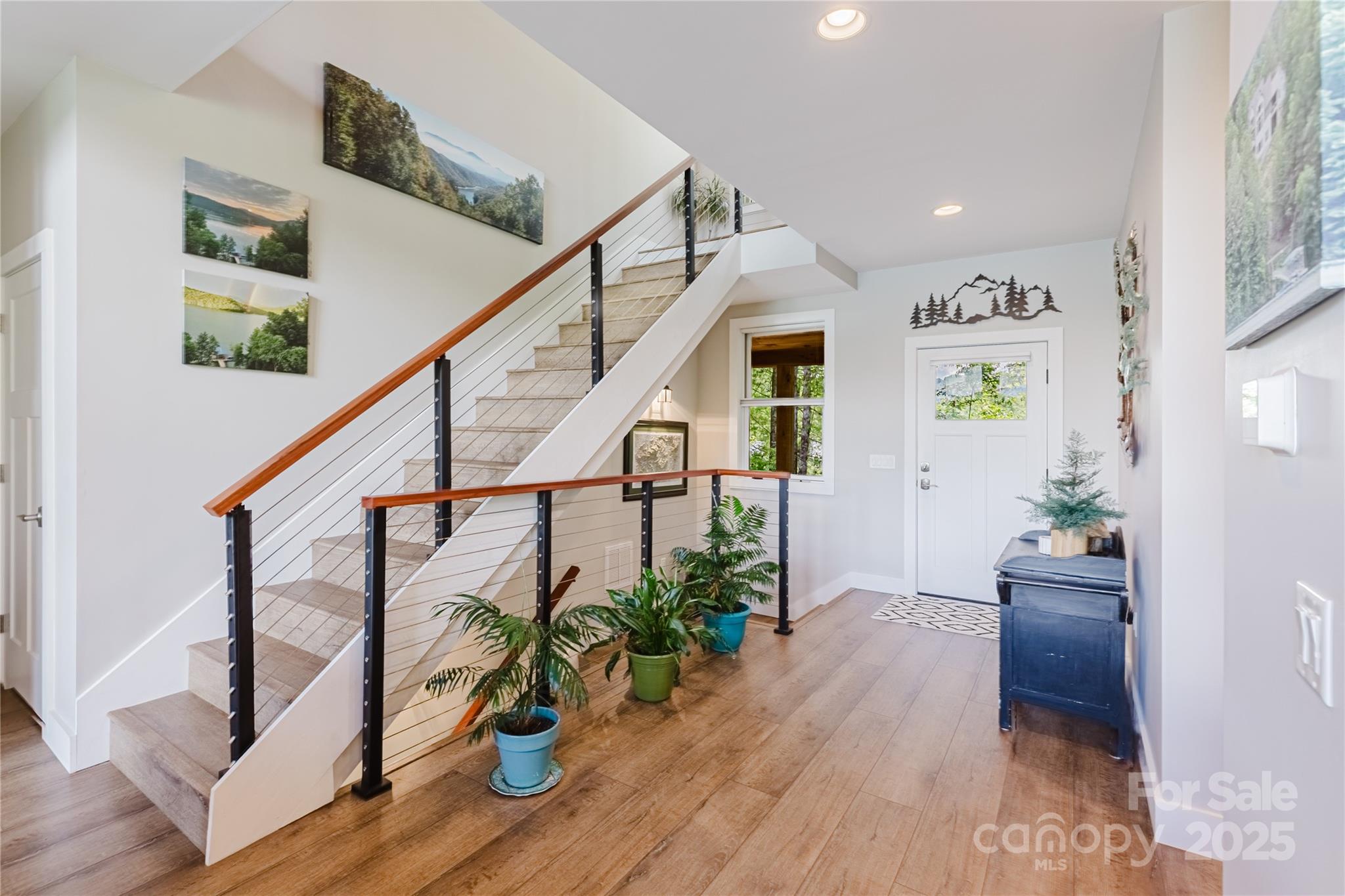 216 Alarka Point Bryson City, NC 28713 - Photo 16 of 47 a view of an entryway with wooden floor and windows