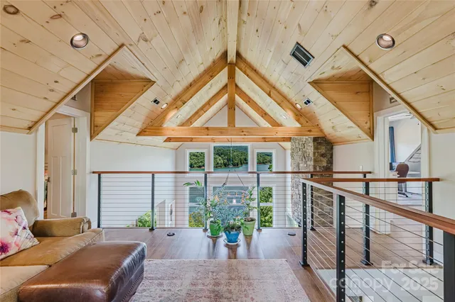 a lobby with furniture and a potted plant