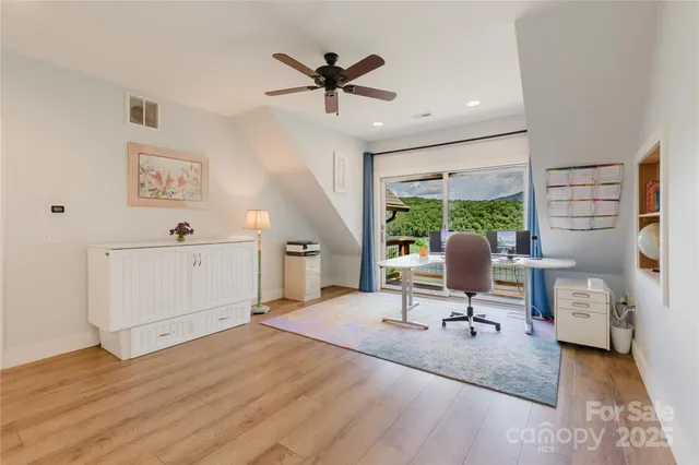 a workspace with furniture and a window