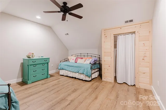a bedroom with a bed and a dresser