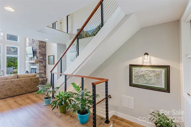a view of entryway with stairs and wooden floor