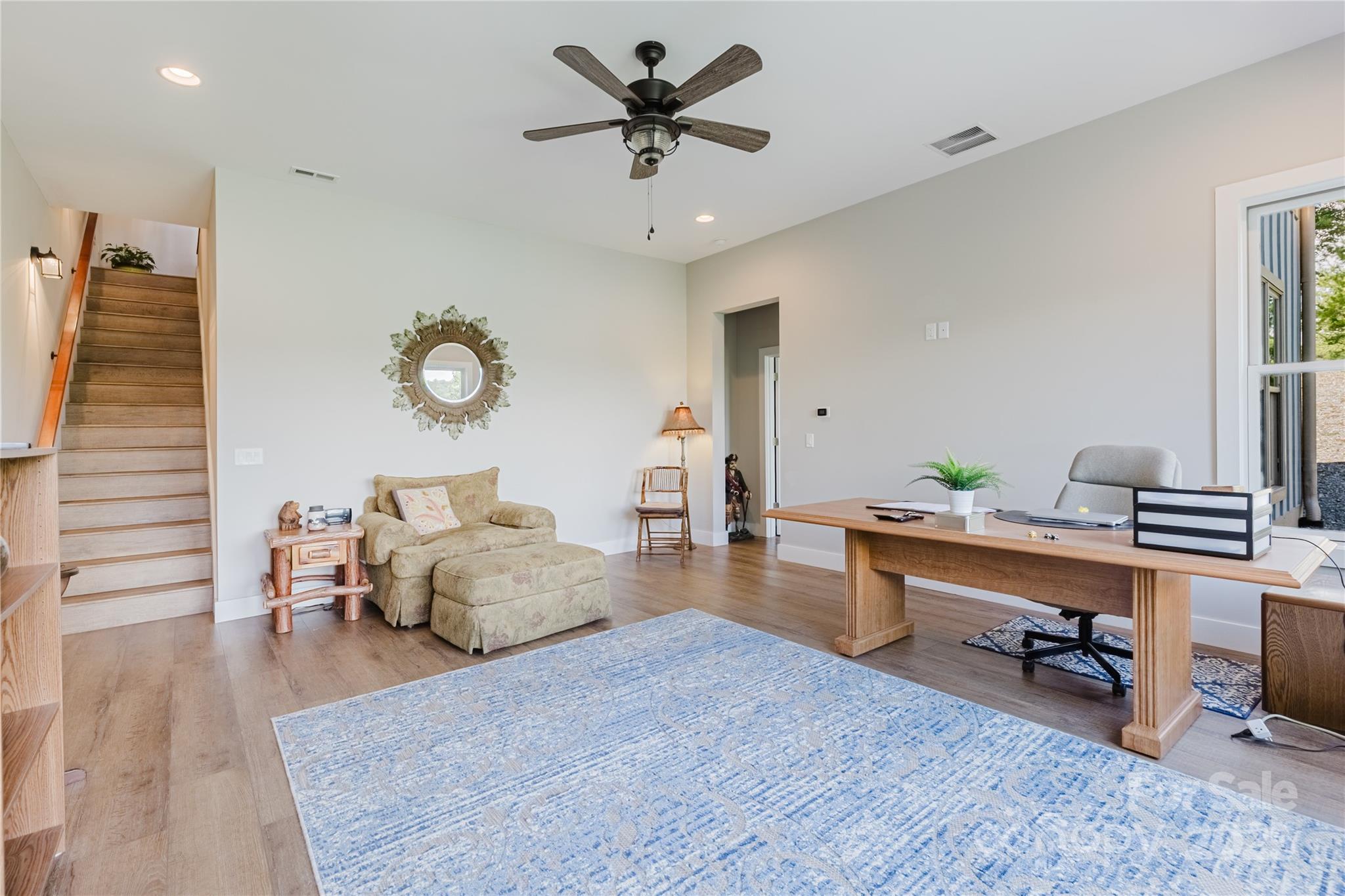 216 Alarka Point Bryson City, NC 28713 - Photo 32 of 47 a living room with furniture and a wooden floor