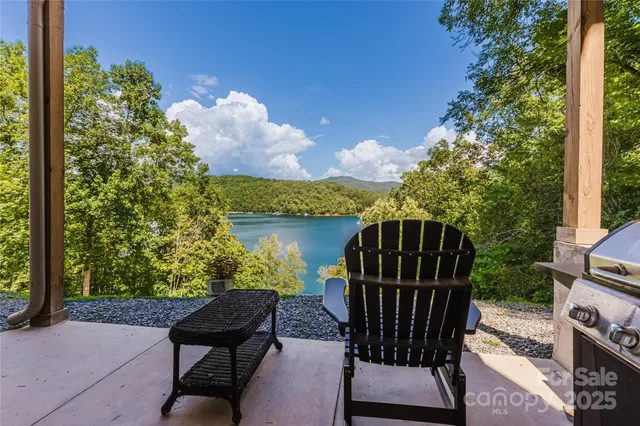 a view of balcony with wooden floor and outdoor seating