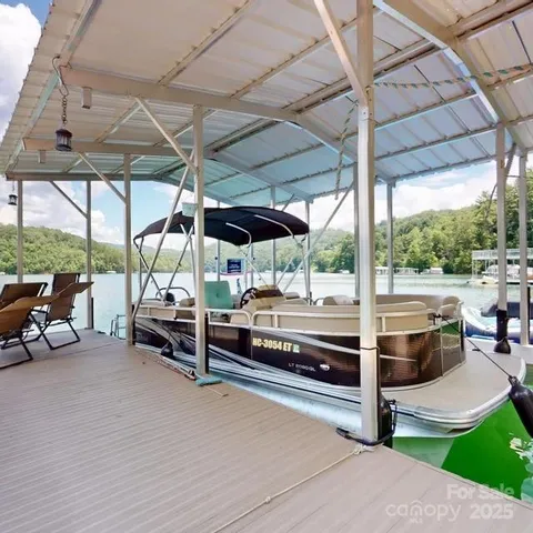 a view of a patio with a table and chairs under an umbrella