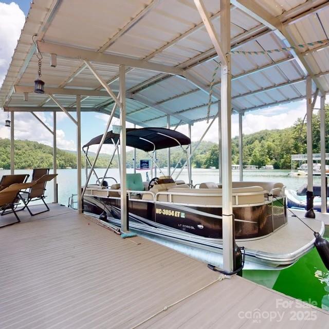 216 Alarka Point Bryson City, NC 28713 - Photo 44 of 47 a view of a patio with a table and chairs under an umbrella
