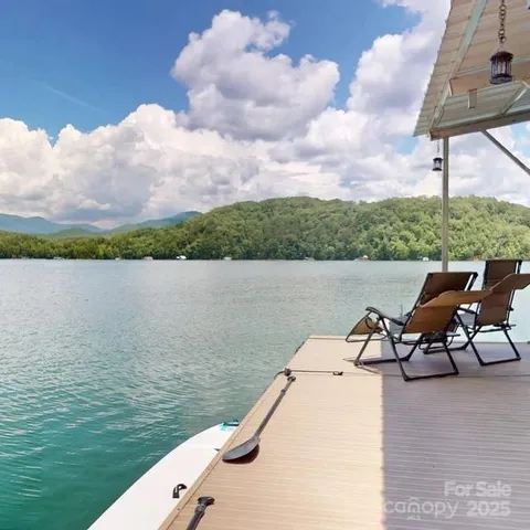 a view of a lake with outdoor seating