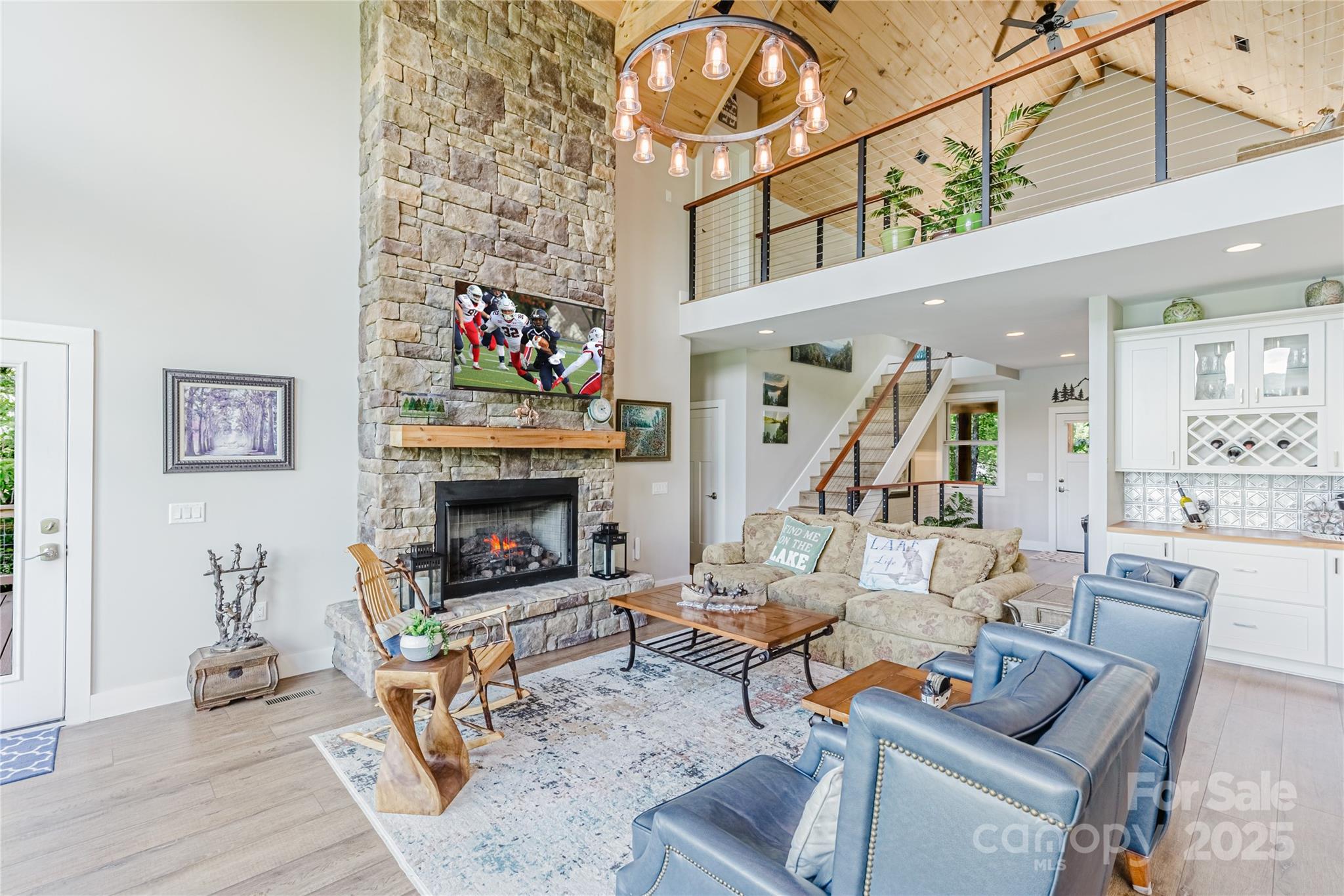 216 Alarka Point Bryson City, NC 28713 - Photo 5 of 47 a living room with furniture and a fireplace