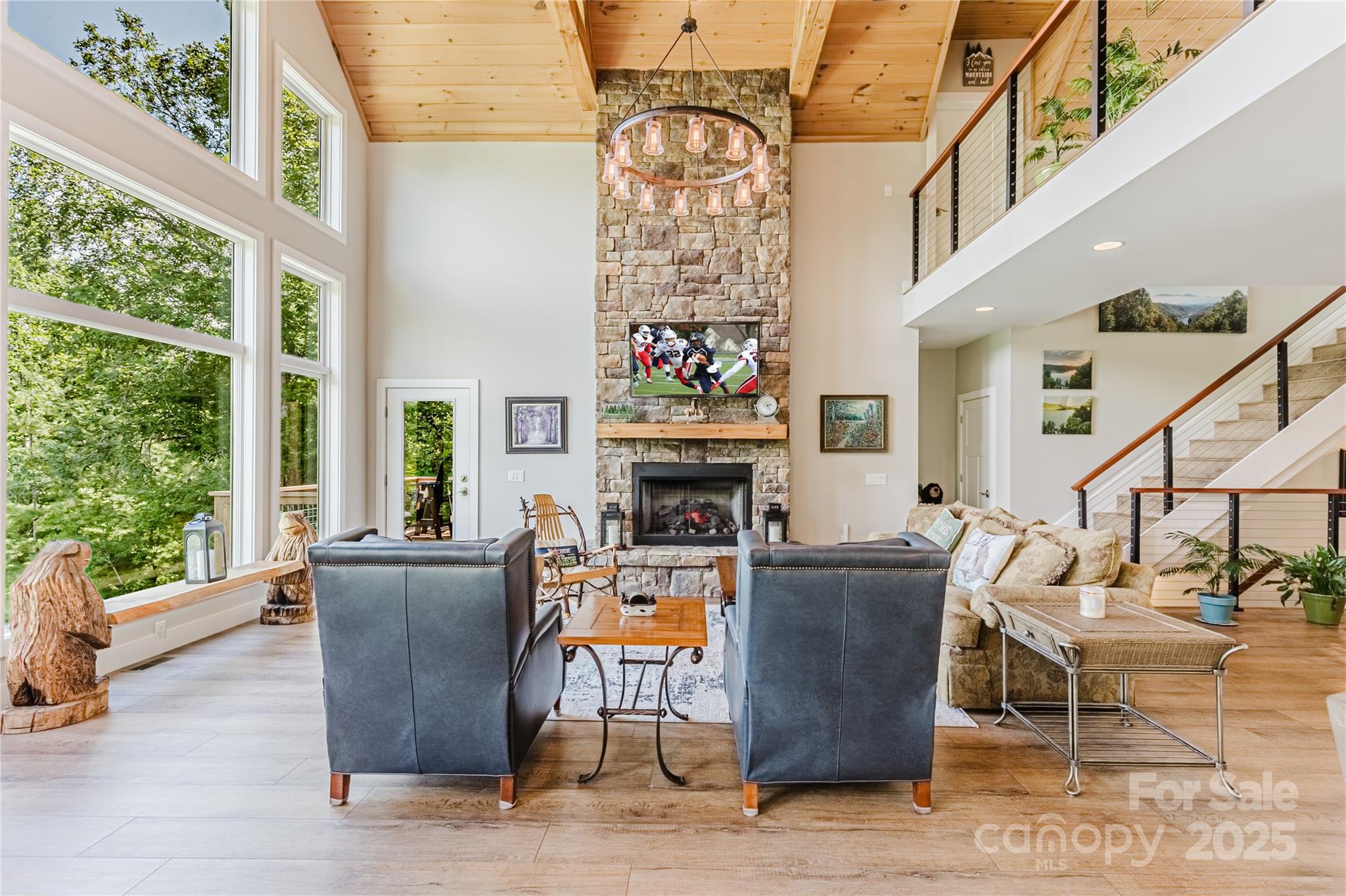 216 Alarka Point Bryson City, NC 28713 - Photo 6 of 47 a living room with fireplace furniture and a large window