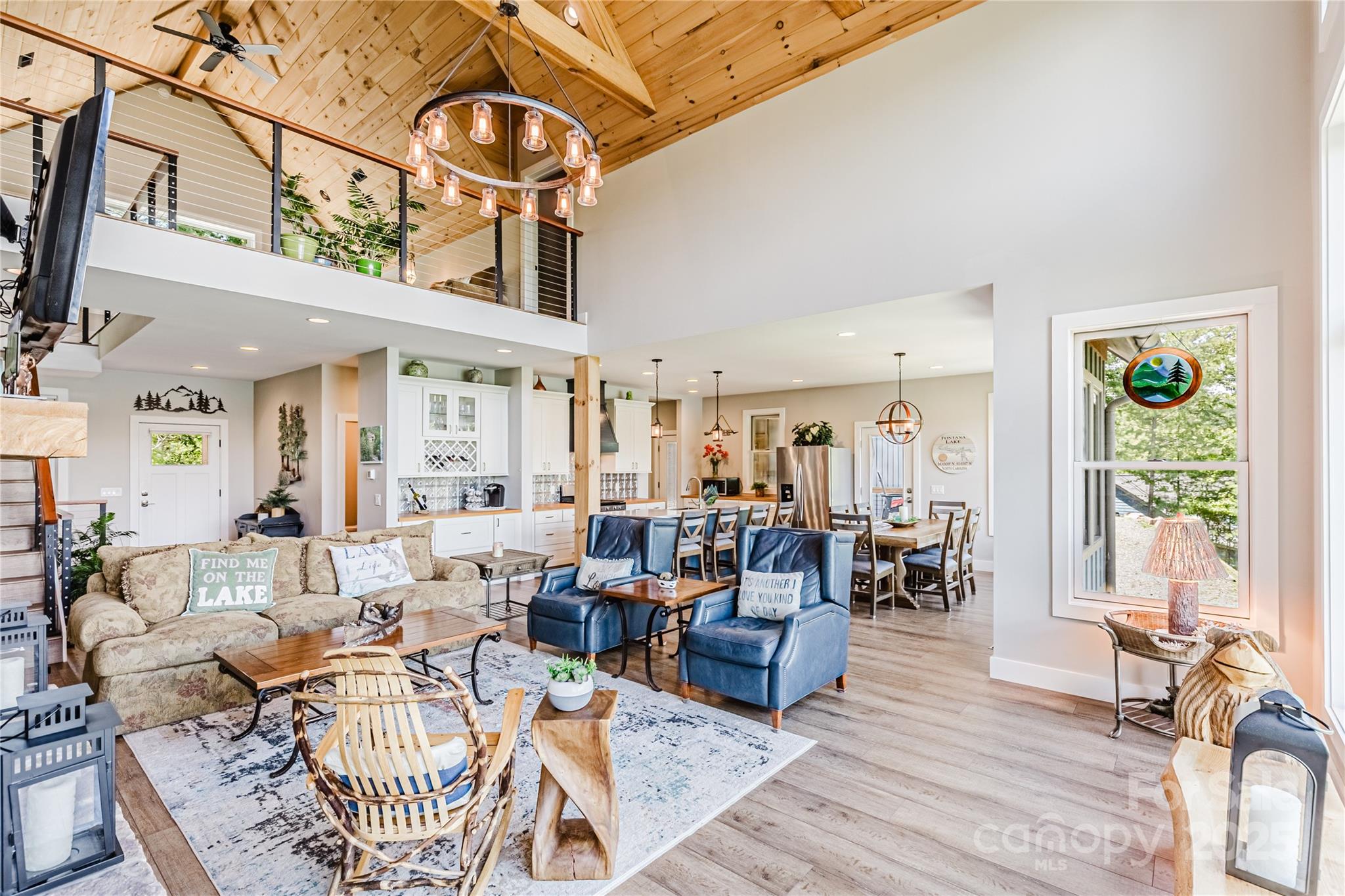 216 Alarka Point Bryson City, NC 28713 - Photo 7 of 47 a living room with furniture a rug and a large window