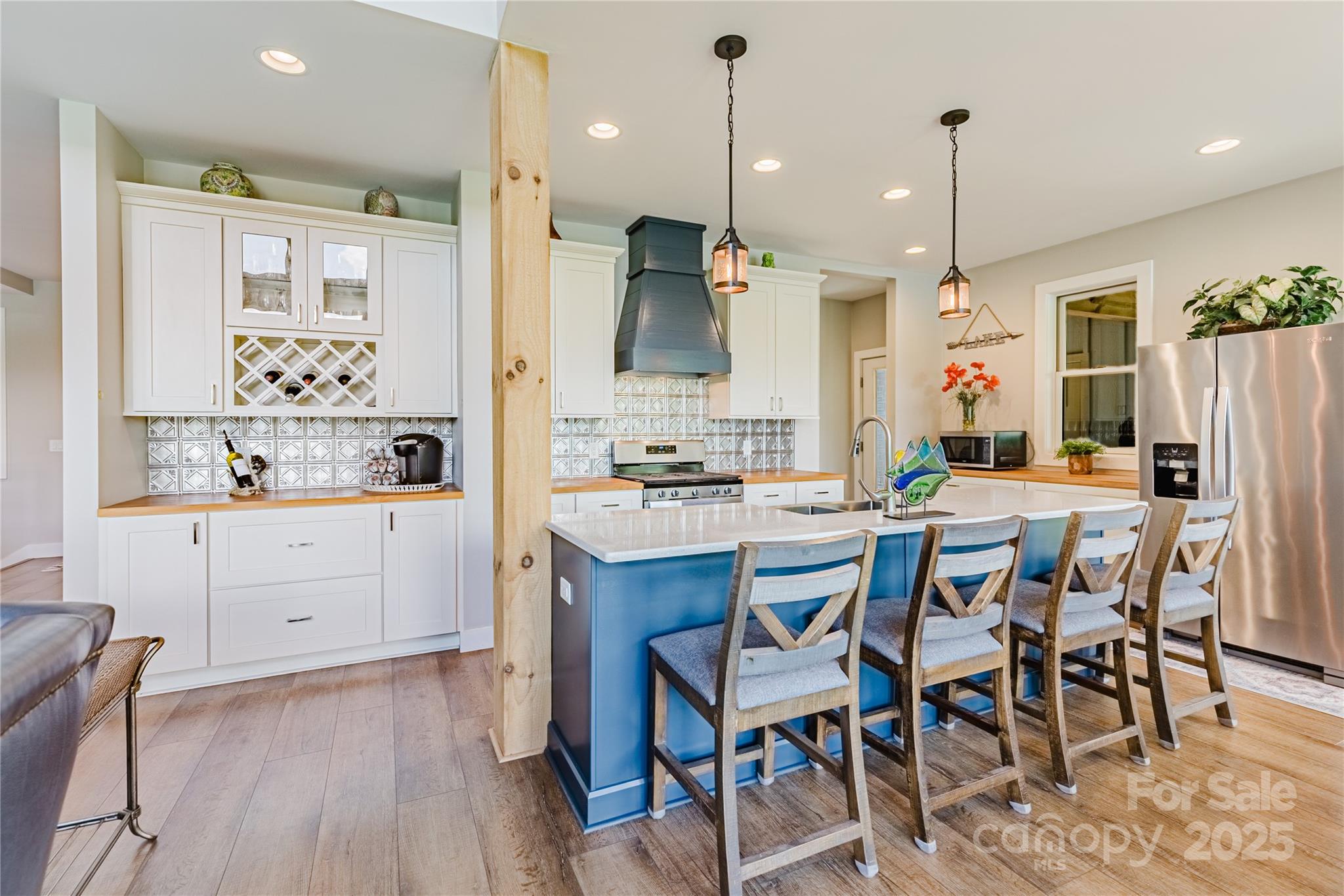216 Alarka Point Bryson City, NC 28713 - Photo 8 of 47 a kitchen with white cabinets and stainless steel appliances