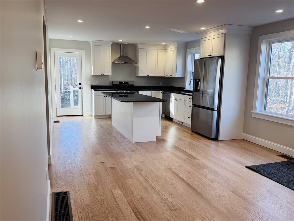 329 Tickle Road Westport, MA 02790 - Photo 12 of 42 a kitchen with stainless steel appliances a refrigerator and a stove top oven