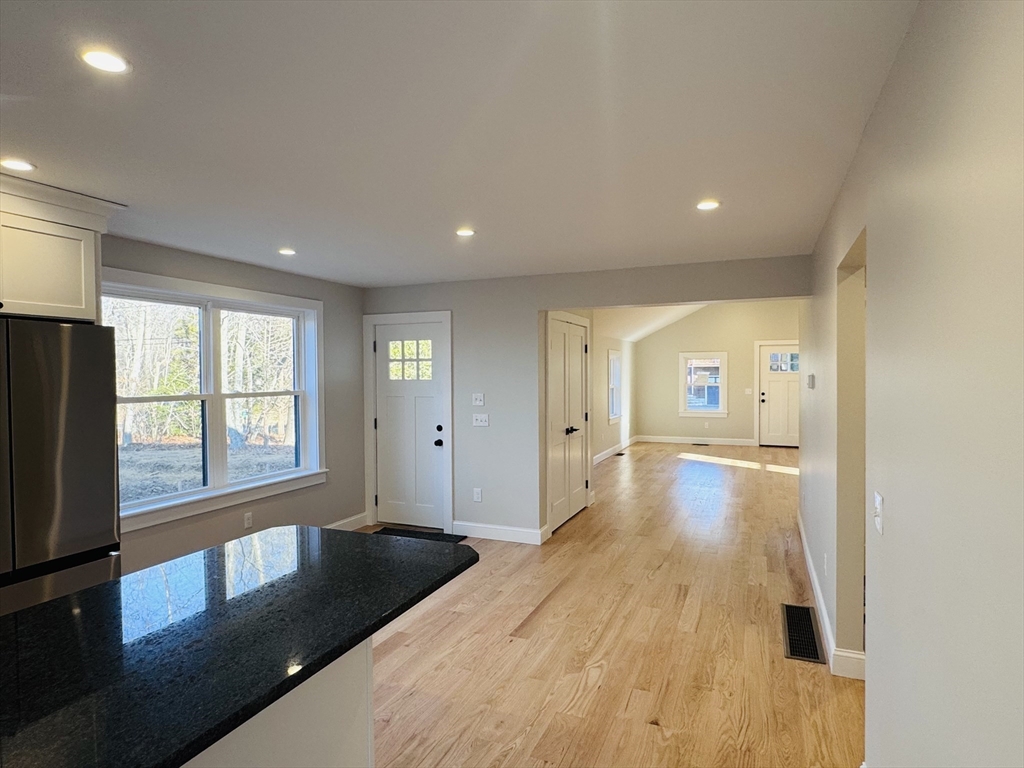 329 Tickle Road Westport, MA 02790 - Photo 13 of 42 a large bedroom with a bed and a large window