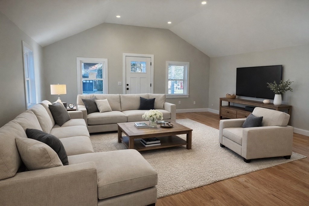 329 Tickle Road Westport, MA 02790 - Photo 14 of 42 a living room with furniture and a flat screen tv