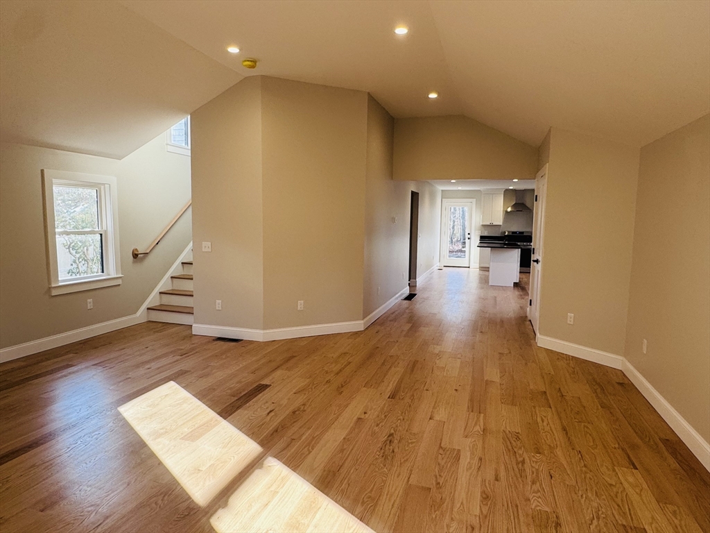 329 Tickle Road Westport, MA 02790 - Photo 17 of 42 a view of a living room with wooden floor and stairs