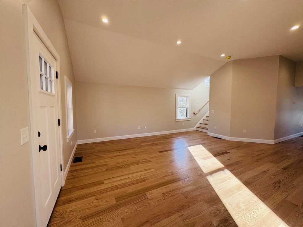 329 Tickle Road Westport, MA 02790 - Photo 18 of 42 a view of a livingroom with wooden floor and staircase