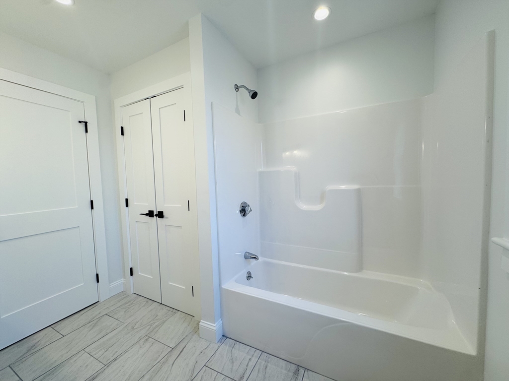 329 Tickle Road Westport, MA 02790 - Photo 41 of 42 a bathroom with a bathtub