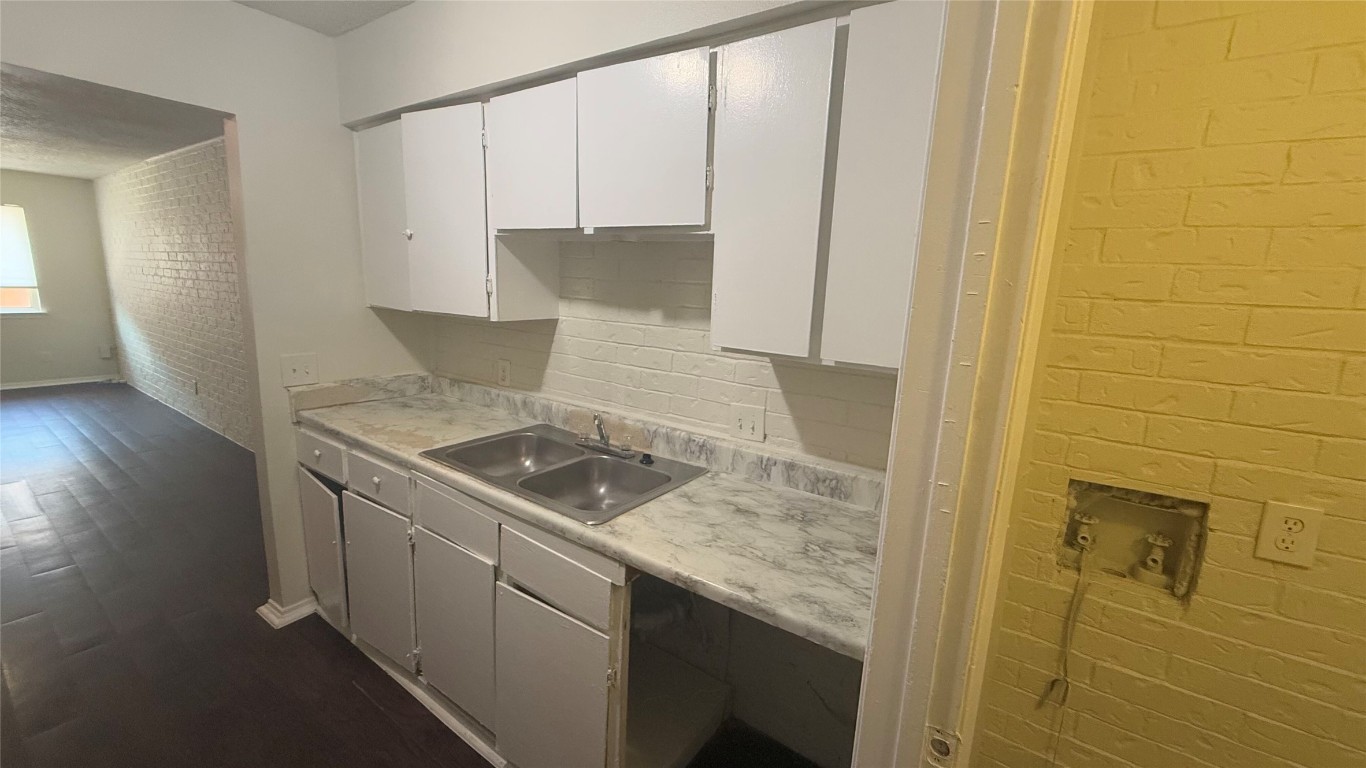 8210 Sam Rayburn Drive, Unit 103 Austin, TX 78753 - Photo 16 of 16 a kitchen with a sink and a stove