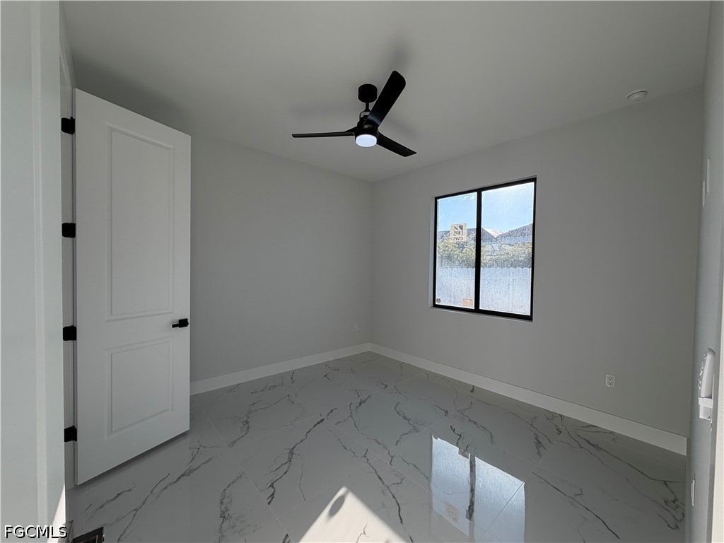 112 Northeast 6th Street Cape Coral, FL 33909 - Photo 18 of 37 wooden floor in an empty room with a window