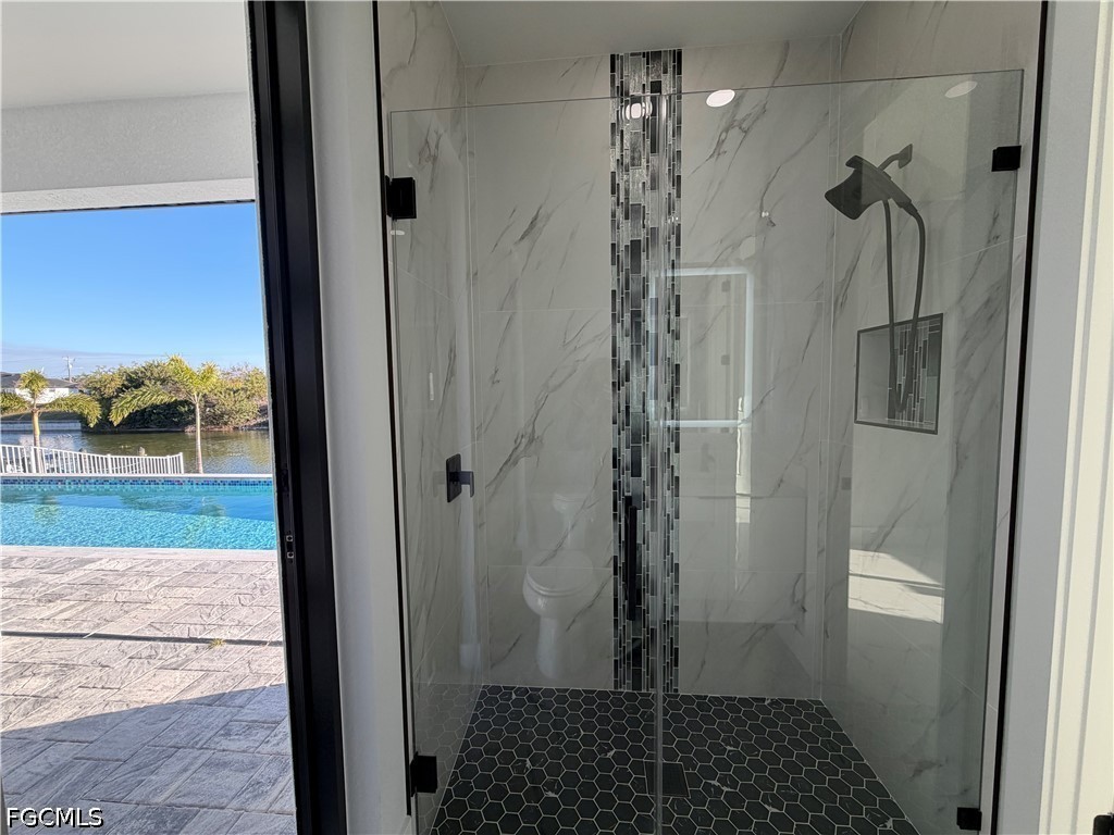 112 Northeast 6th Street Cape Coral, FL 33909 - Photo 22 of 37 a bathroom with a shower