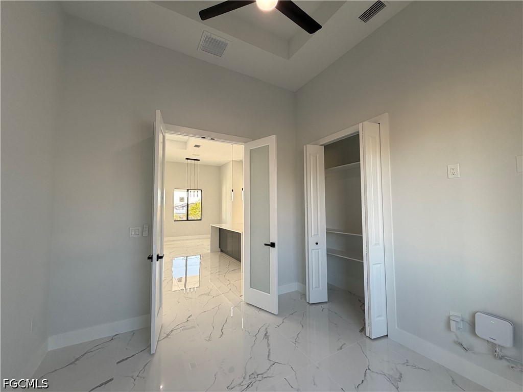 112 Northeast 6th Street Cape Coral, FL 33909 - Photo 25 of 37 wooden floor in a gallery with view of bathroom