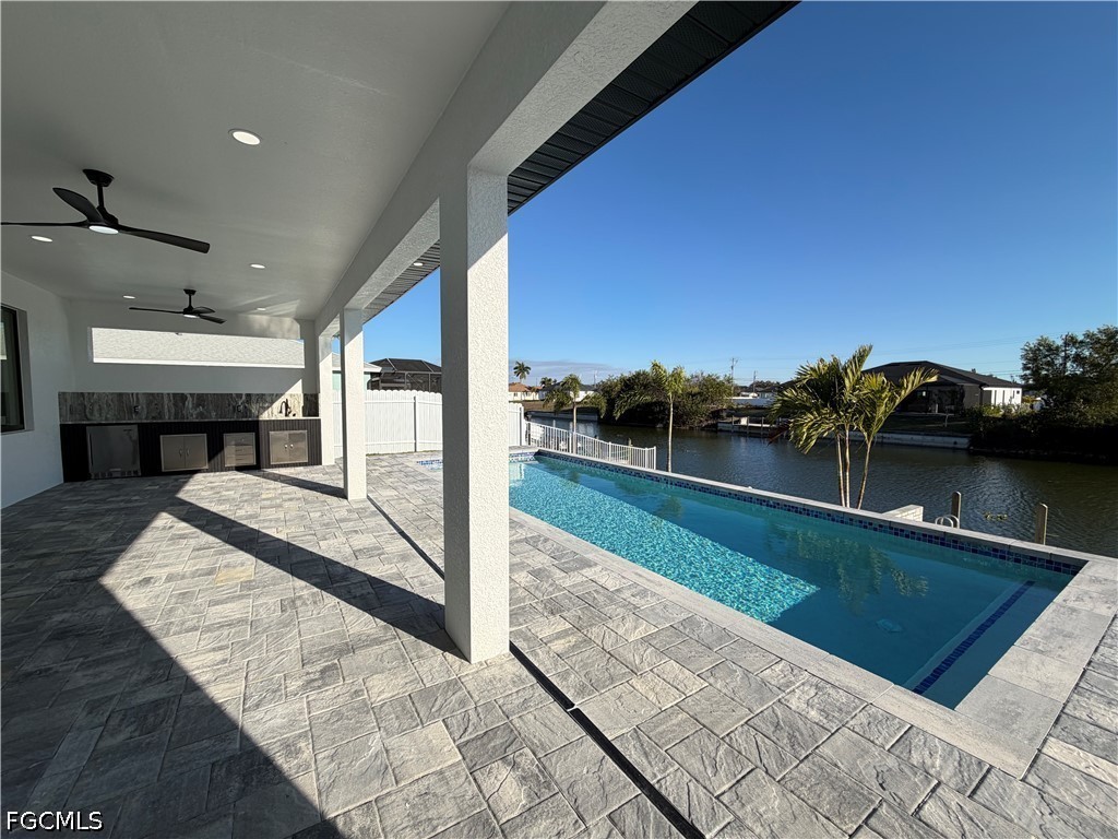 112 Northeast 6th Street Cape Coral, FL 33909 - Photo 26 of 37 a view of swimming pool with a lounge chair