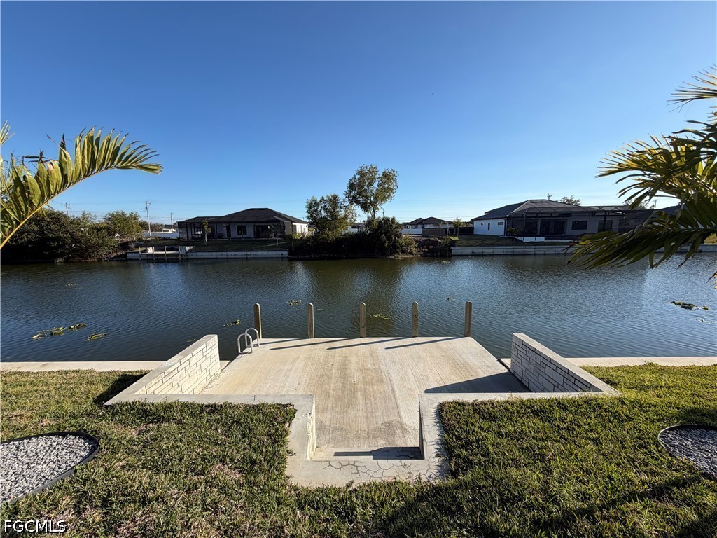 112 Northeast 6th Street Cape Coral, FL 33909 - Photo 33 of 37 an aerial view of a house with outdoor space and lake view