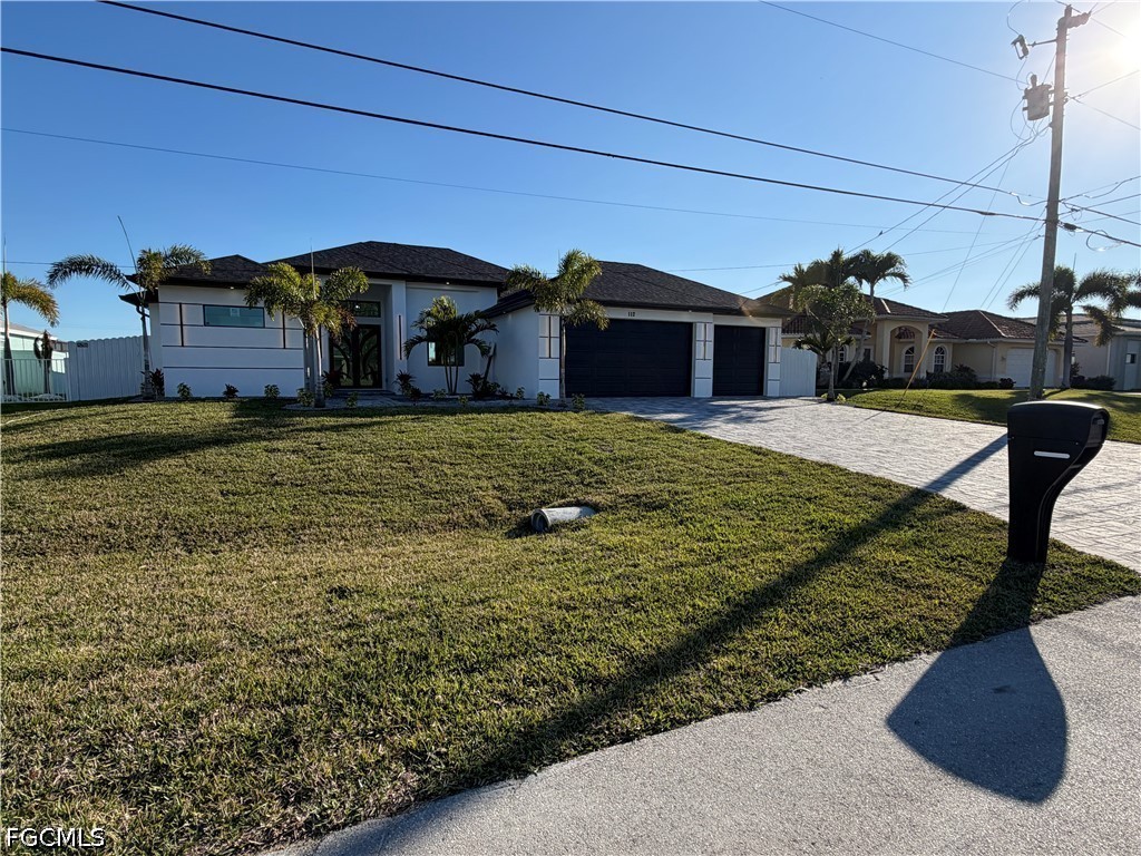 112 Northeast 6th Street Cape Coral, FL 33909 - Photo 36 of 37 a house view with a outdoor space