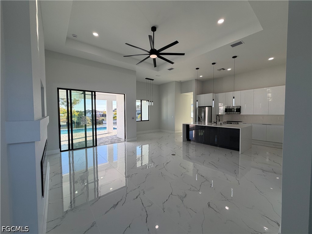 112 Northeast 6th Street Cape Coral, FL 33909 - Photo 4 of 37 a large windows with a sink and cabinets