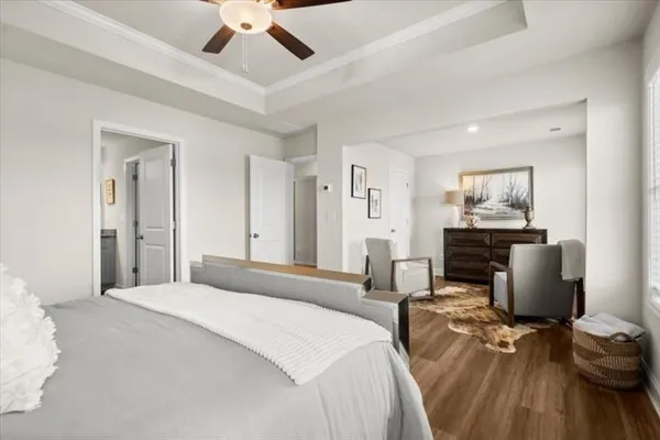 a bedroom with a bed and a chair