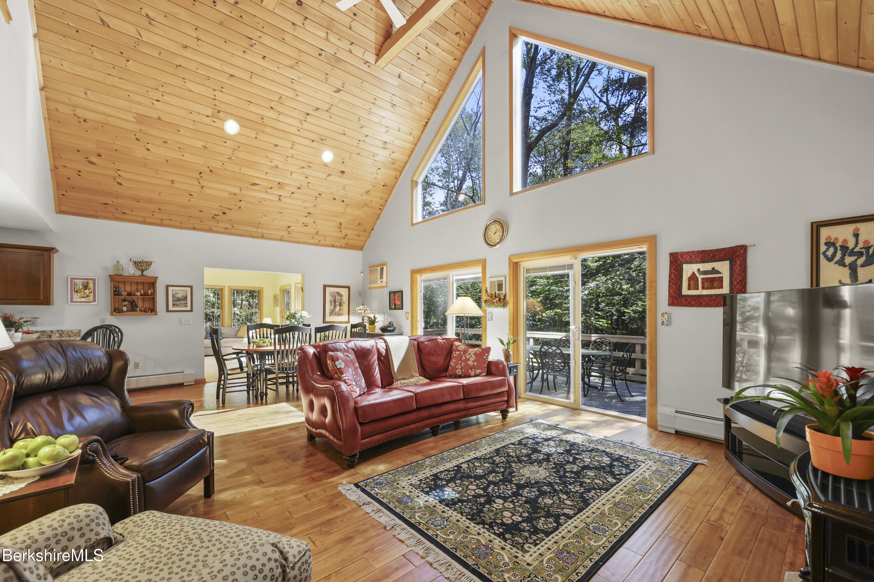 a living room with furniture rug and a table