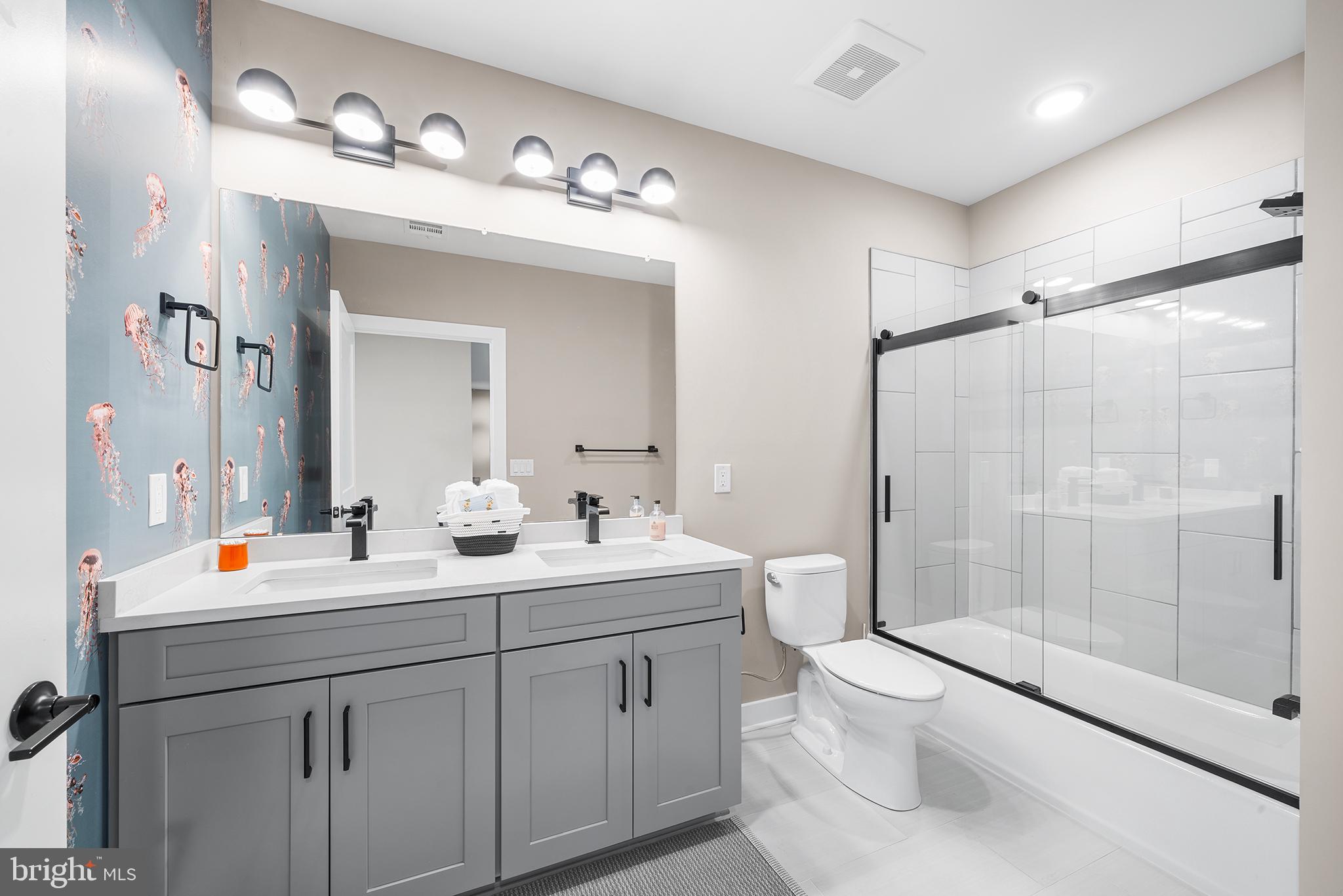 4535 Riverside Way Philadelphia, PA 19127 - Photo 31 of 43 a bathroom with a double vanity sink toilet mirror and shower