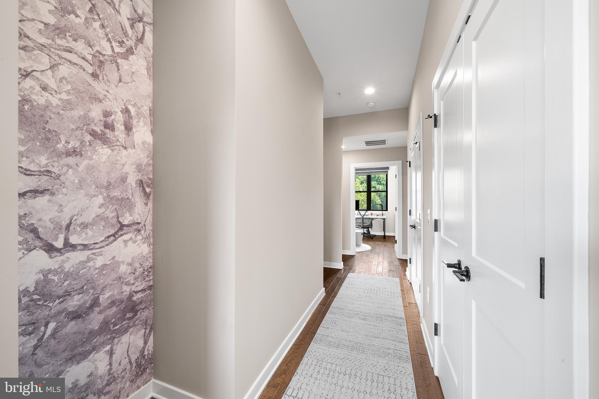4535 Riverside Way Philadelphia, PA 19127 - Photo 35 of 43 a view of a hallway with wooden floor and a bathroom