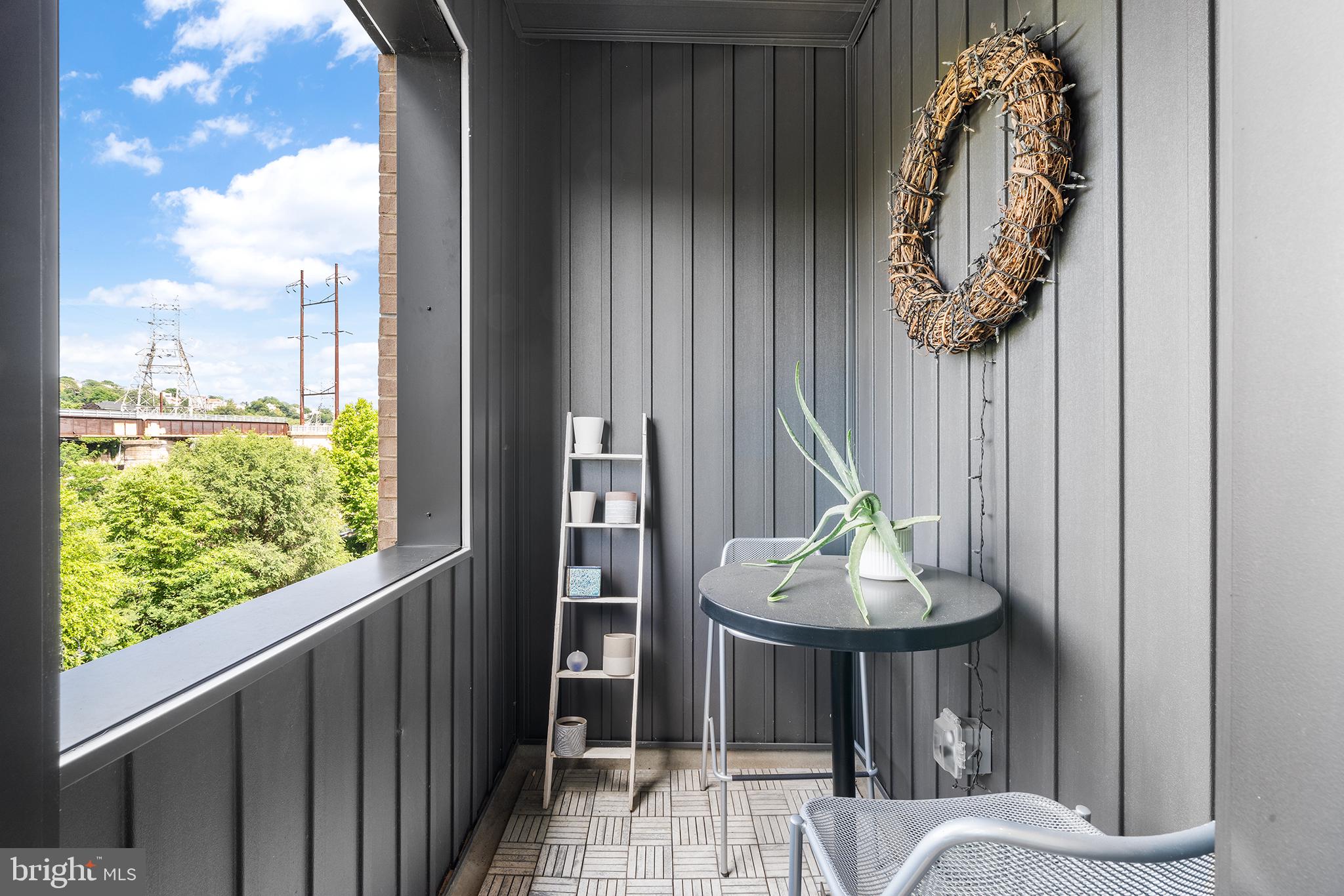 4535 Riverside Way Philadelphia, PA 19127 - Photo 36 of 43 a table and a vase of flowers sitting on a table