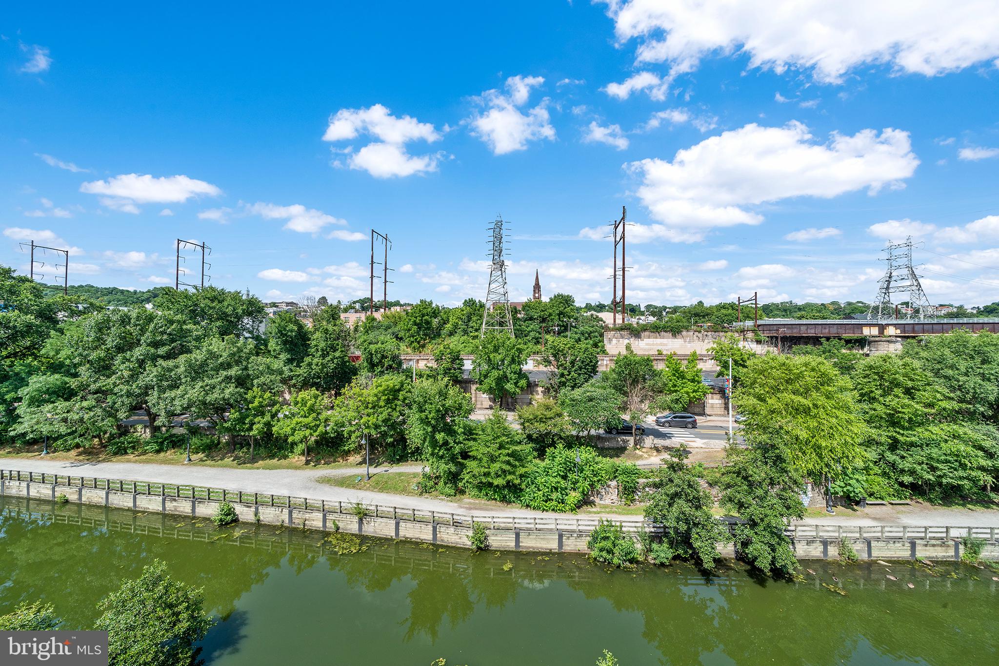 4535 Riverside Way Philadelphia, PA 19127 - Photo 7 of 43 a view of a lake with a building in the background
