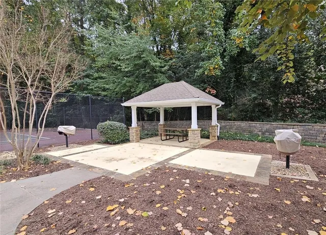 a front view of a house with yard and seating area